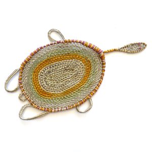 Woven turtle made from Pandanus fibre in a variety of colours