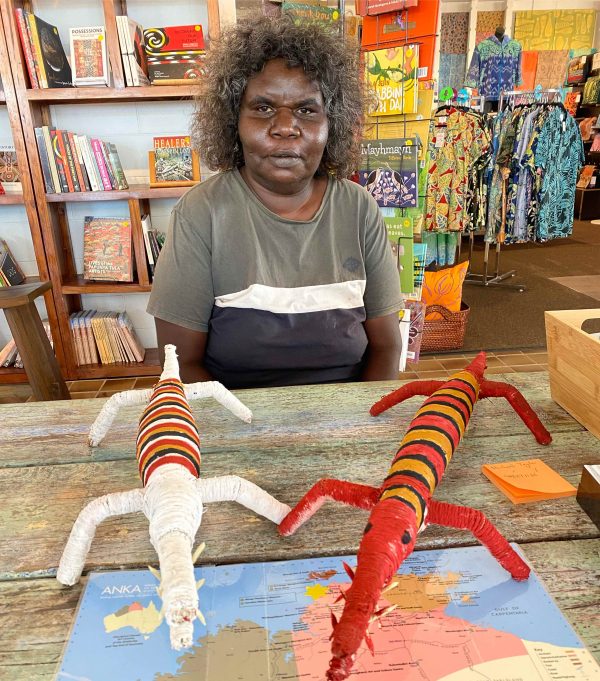 Gloreen Campion with two of her crocodile sculptures made from natural fibres at Songlines Darwin