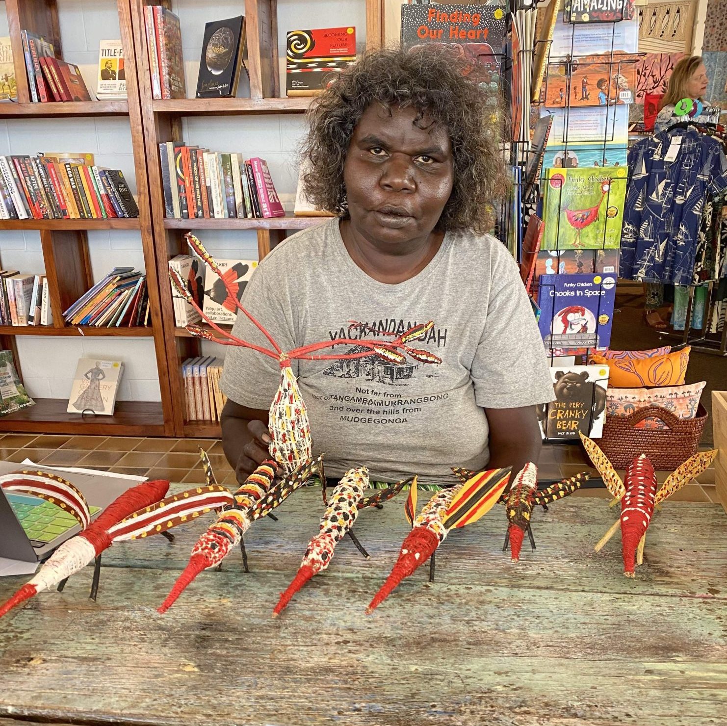 Gloreen Campion with mosquito sculptures from Maniningrida at Songlines ARts