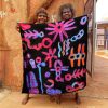 Cassaria Young holding her silk scarf created by One of Twelve